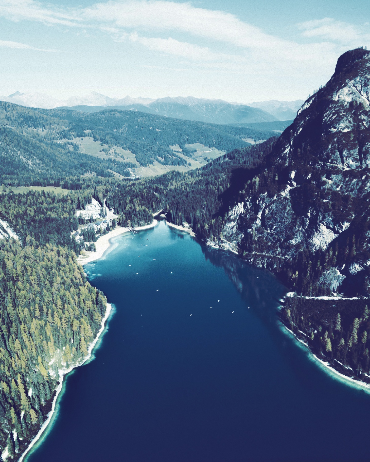 Alpine lake framed by forested peaks